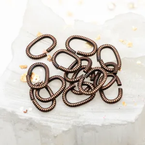 Antique Copper 9mm Textured Oval Jump Rings - 12pcs