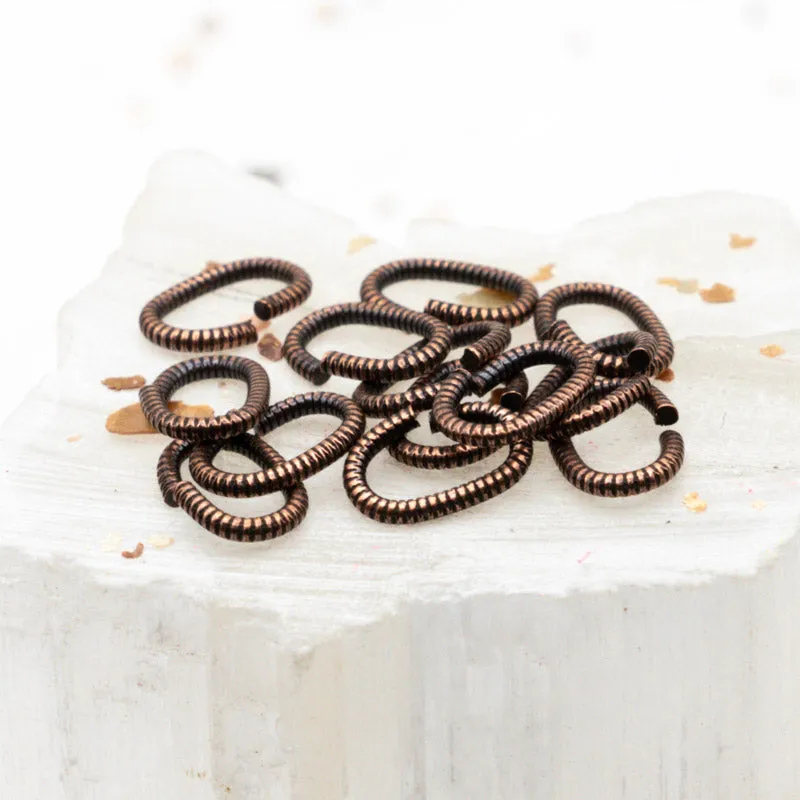 Antique Copper 9mm Textured Oval Jump Rings - 12pcs
