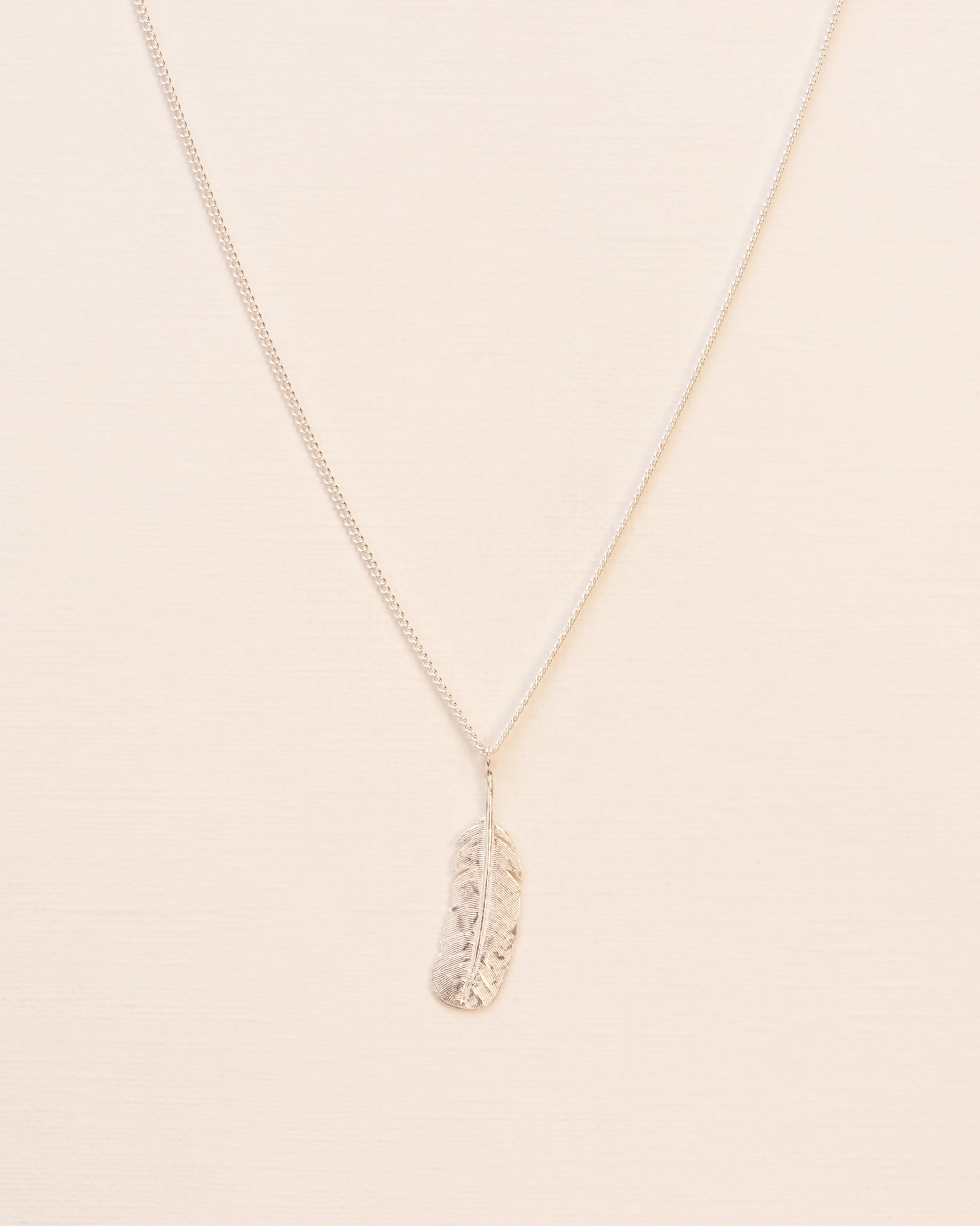 Necklace with feather pendant