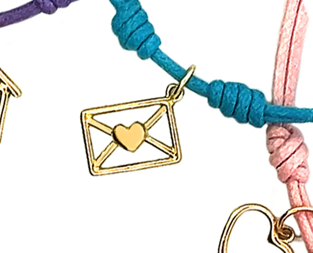 Rope bracelets with dangling yellow gold charms